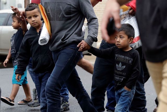 Young immigrants arrive with their parents at the Catholic Charities RGV after they were processed and released by U.S. Customs and Border Protection, in McAllen, Texas.